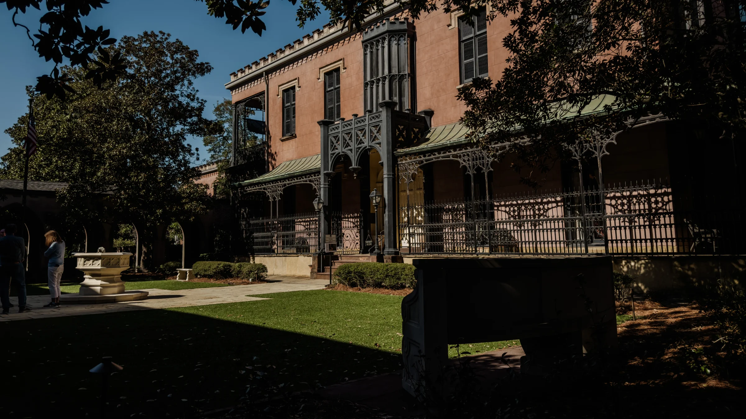 From the side garden — veranda and parish-yard fountain